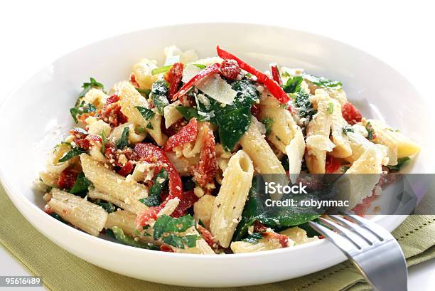 Close Up Of Delicious Pasta On White Plate Stock Photo - Download Image Now - Pasta Salad, Tomato, Spinach