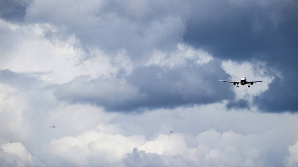 istock Three jet planes / aircrafts enters landing runway 956165908
