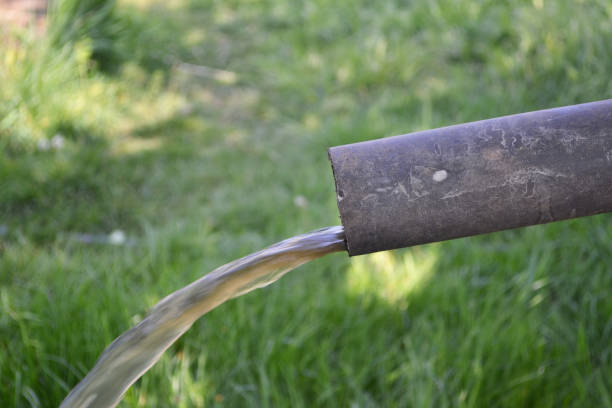 istock Dirty water flows from an old metal pipe. 956166252