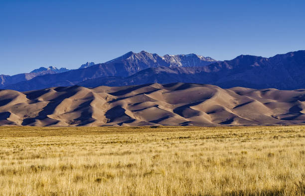 Great Sand Dunes Colorado - Large scenic dunes mountain landscape. Great Sand Dunes National Park, Colorado USA.
