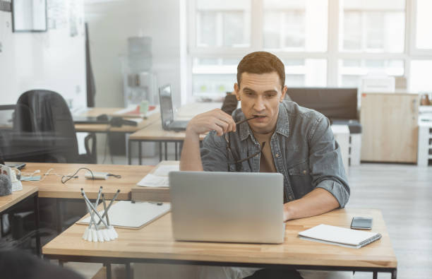 istock Pensive male watching at appliance 956167592