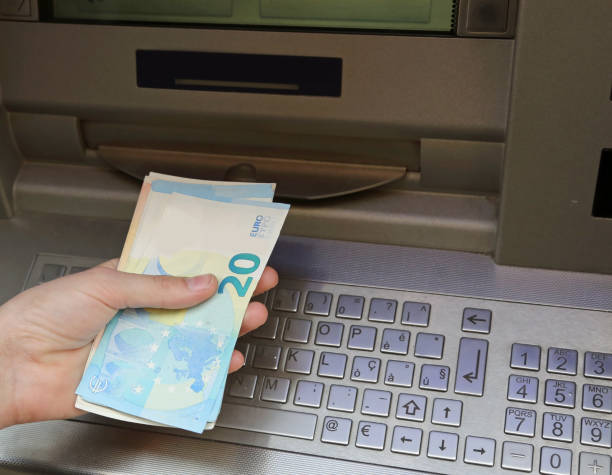istock atm machine and european banknotes 956170858