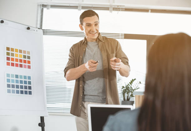 istock Glad employer demonstrating colors on board 956170962