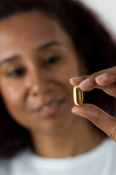 istock Woman Showing Pill 956171220