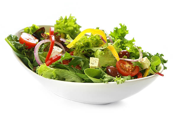 istock A Greek salad in a bowl on a white background 95617182