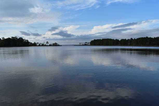 istock Blue sky reflects on bay inlet 956172204