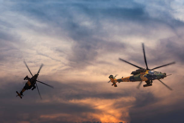 istock Military gunships flying against dramatic sky at sunset 956172508