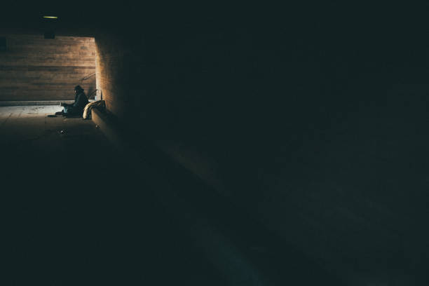 istock Homeless in dark tunnel 956175802