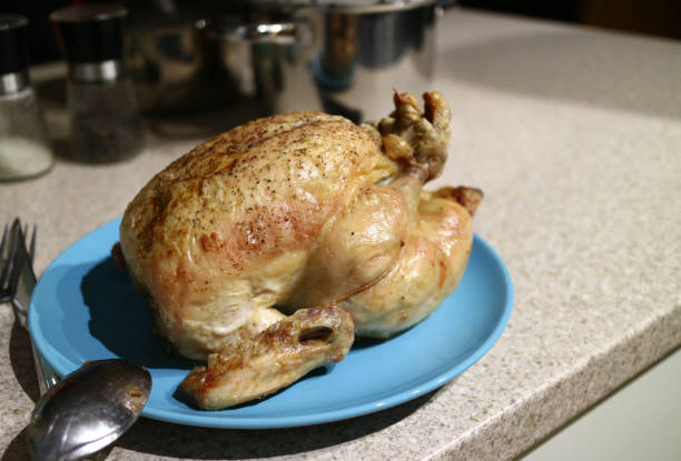 istock Side view of a freshly roasted chicken. 956175898