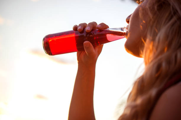 istock Young woman having a drink 956177122