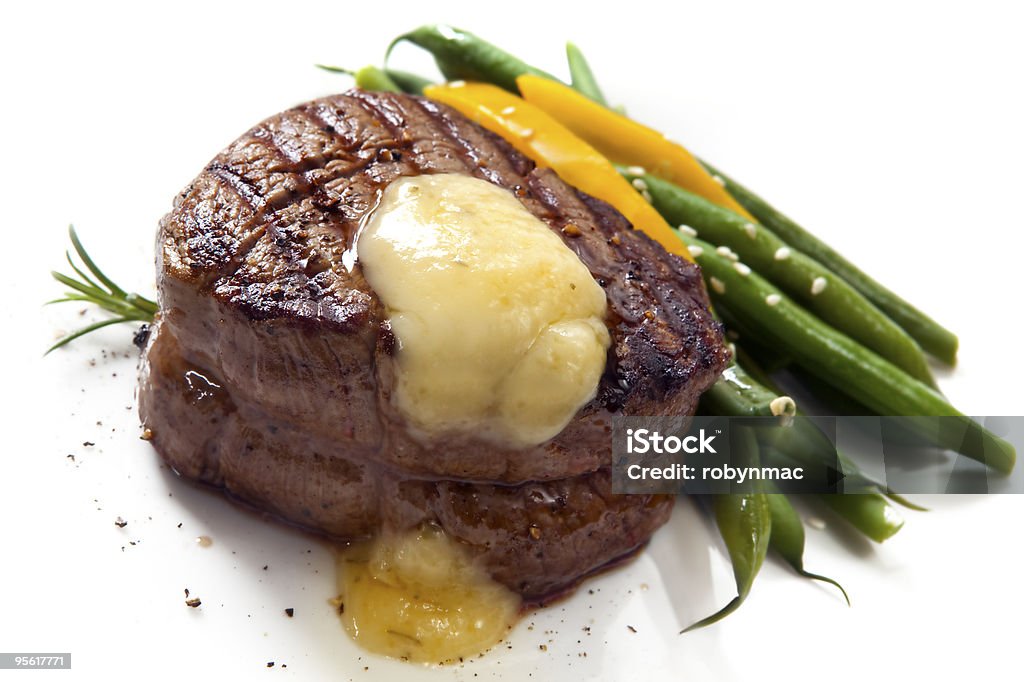 Beautiful filet mignon with asparagus Thick-cut fillet steak with Bearnaise sauce, accompanied by green beans and yellow capsicum. Eye Stock Photo