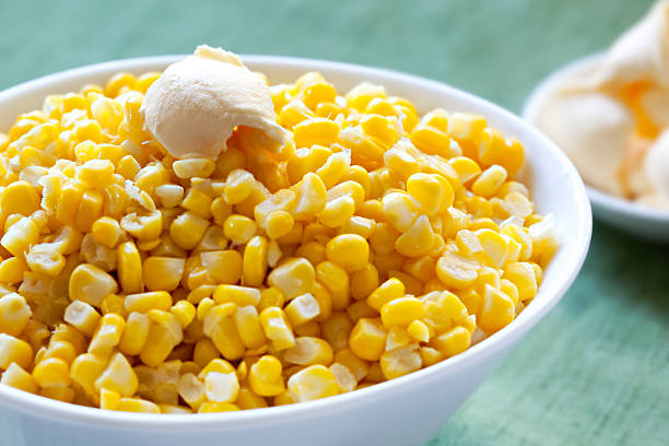 Plenty of sweet corn on a white bowl