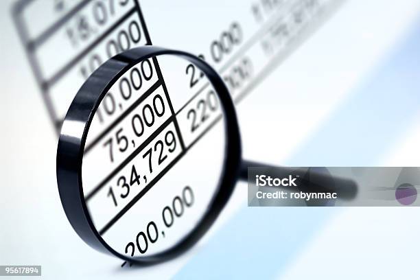 A Magnifying Lens Focusing On The Numeric Figures Stock Photo - Download Image Now - Analyzing, Blue, Business