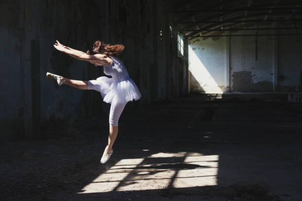 istock Ballerina dancing in an abandoned building 956179606