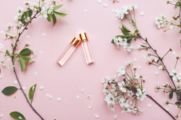 Two bottles of perfume with apricot blossom