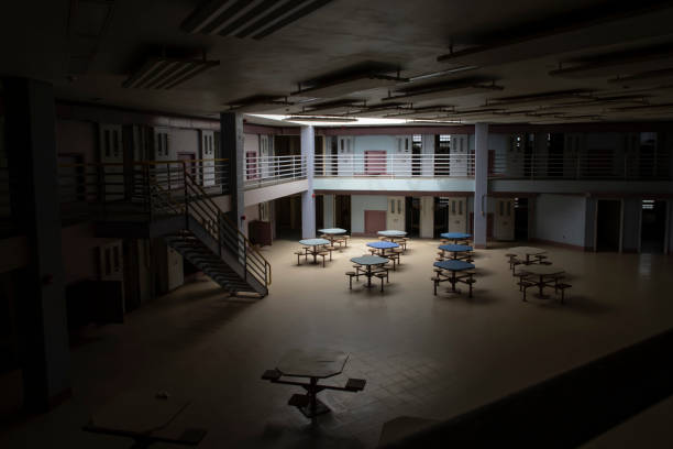 Interior of state prison with light in common room stock photo