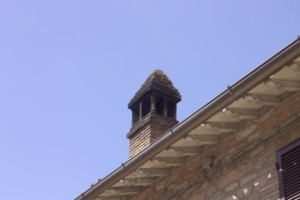 istock Isolated chimney on the roof - Italian architecture (Spello, Umbria, Italy) 956185660