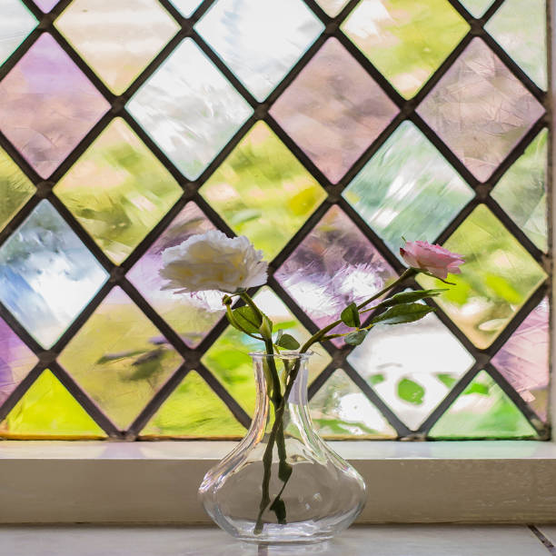 istock Colorful stained glass with flowers in vase 956187526