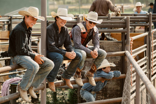 Group of Cowboys Hanging out Group of Cowboys Friends Hanging out at Rodeo Arena Chest Protector stock pictures, royalty-free photos & images