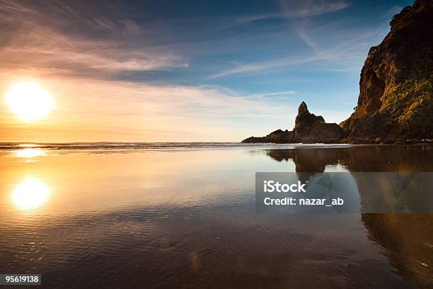 Sunset At Piha Beach Stock Photo - Download Image Now - New Zealand, Piha Beach, Sunset