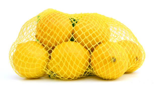 istock lemons group isolated in bag on white background 956192374