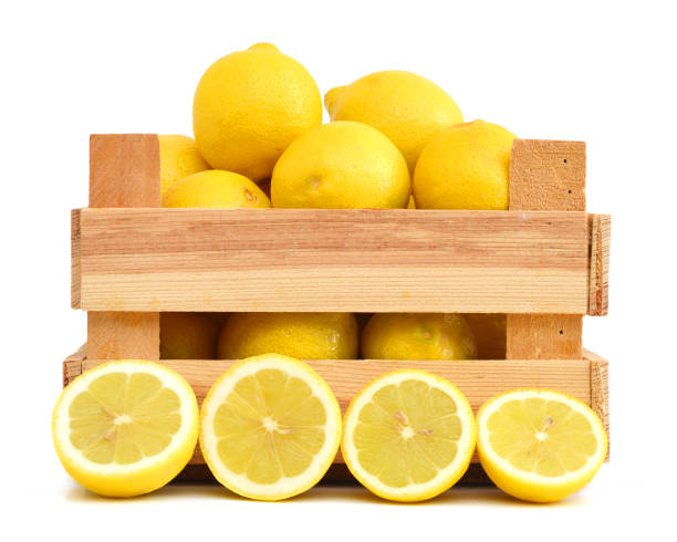 istock fresh lemons in a wooden box on a white background 956192628