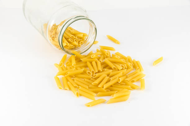 istock penne pasta isolated on white background 956192954