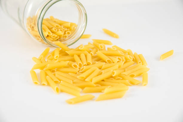 istock penne pasta isolated on white background 956192980