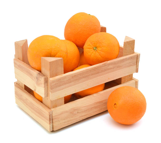 istock fresh oranges  in a wooden box on a white background 956193332