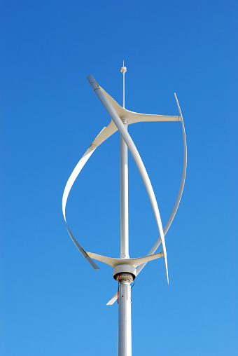Vertical axis energy wind turbines - Copy space - Blue sky 