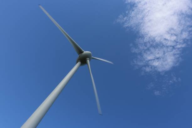 istock Wind turbine, clouds and blue sky 956211400