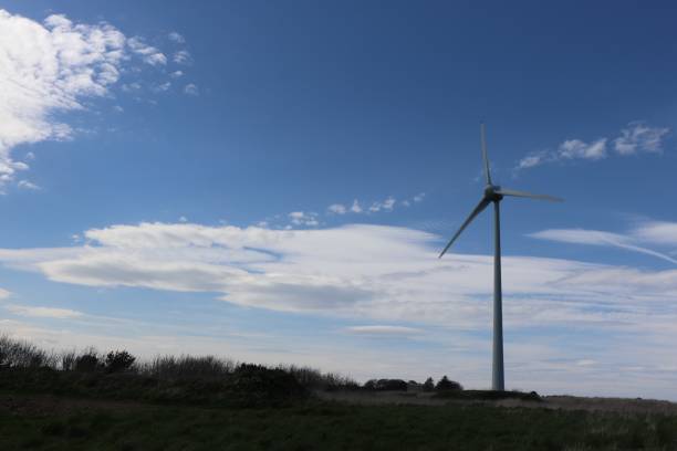 istock Wind turbine, clouds and blue sky 956211444