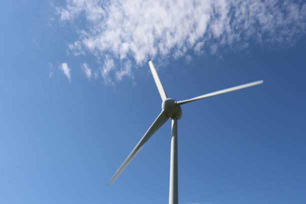 istock Wind turbine, clouds and blue sky 956211636