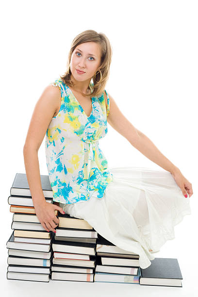 istock woman sitting on books 95621227