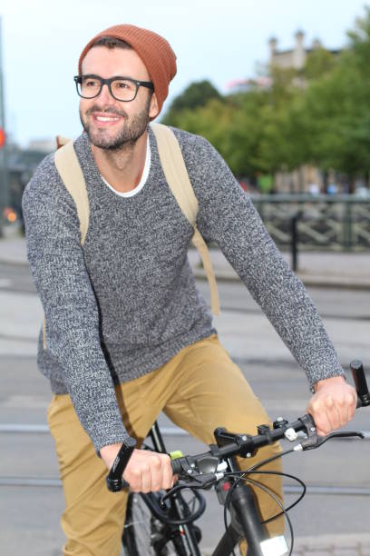 istock Stylish man riding bicycle in the city 956214450