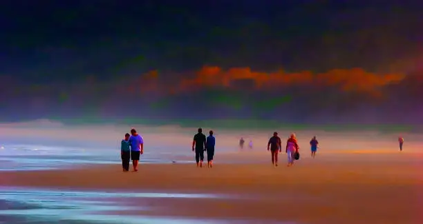 everal couples and one lone person strolling on the beach. The couples show various stages of relationships from new love to a couple who have been together for quite a while.