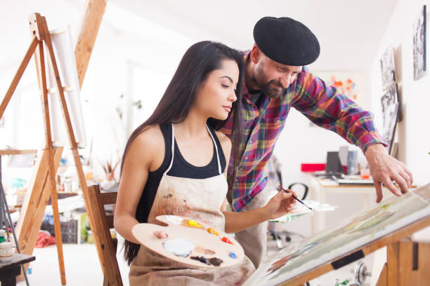 istock Student and teacher working in atelier 956218170