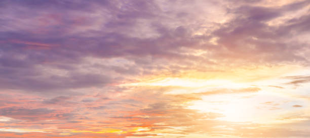 istock Dramatic sunset and sunrise sky with beautiful and colorful nice soft cloud background concept. 956218192