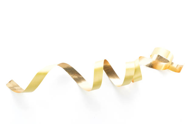 istock Golden ribbon roll isolated on white background 956218892