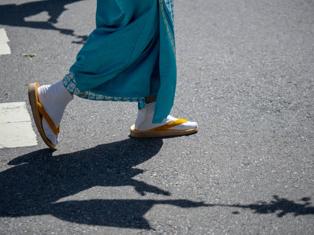 Woman wearing festive Japanese tabi socks with sandals Woman wearing festive Japanese tabi socks with sandals marching outdoors japan women human foot japanese culture stock pictures, royalty-free photos & images