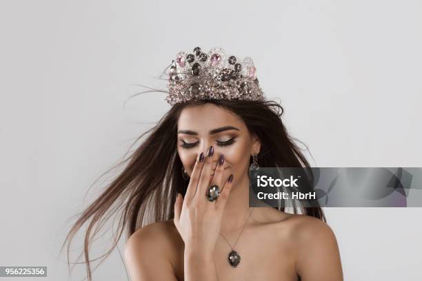 Happy Young Woman Girl Smiling Shy Stock Photo - Download Image Now - Crown - Headwear, One Woman Only, Queen - Royal Person