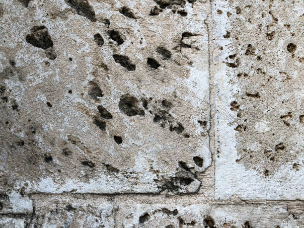 istock Close up of natural stone wall. Stone wall texture 956227780