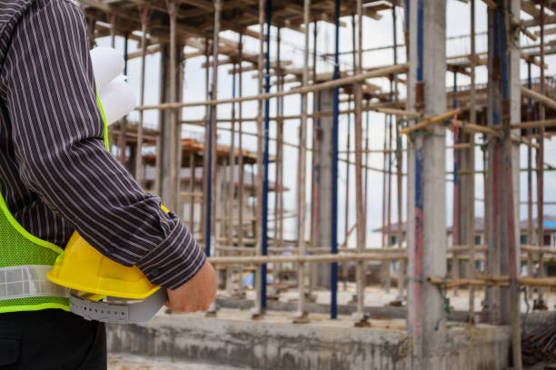 istock professional engineer worker at the house building construction site 956230750