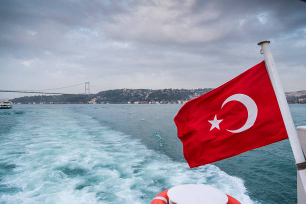 istock Turkish flag on ship with the background of Istanbul Bosphorus Bridge 956230894