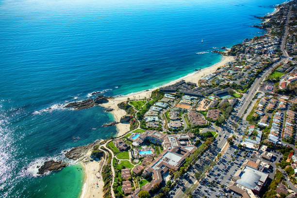Laguna Beach Coastal Aerial The beautiful community of Laguna Beach in southern Orange County, California shot from an altitude of about 1500 feet featuring Treasure Island community park, Victoria beach, luxury homes along the coastline, and U.S. Highway 1, known as the Pacific Coast Highway - one of America's most scenic roads. laguna niguel stock pictures, royalty-free photos & images