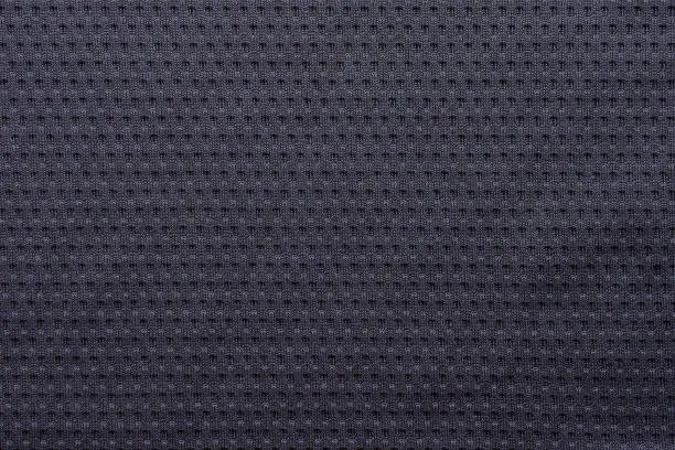 Photo of Black fabric sport clothing football jersey texture background