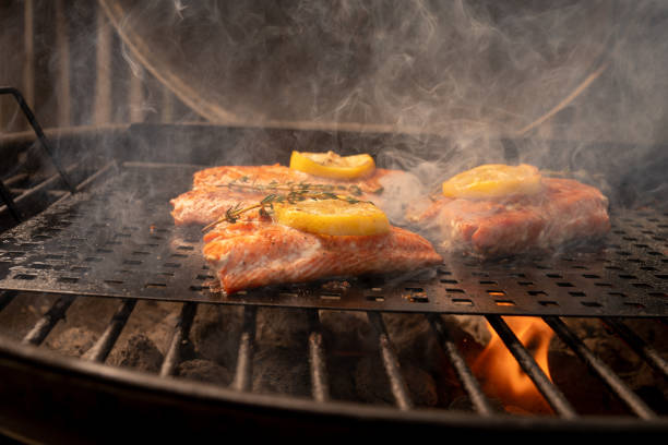 istock Salmon Steaks on a Grill with Lemon and Herb 956235016
