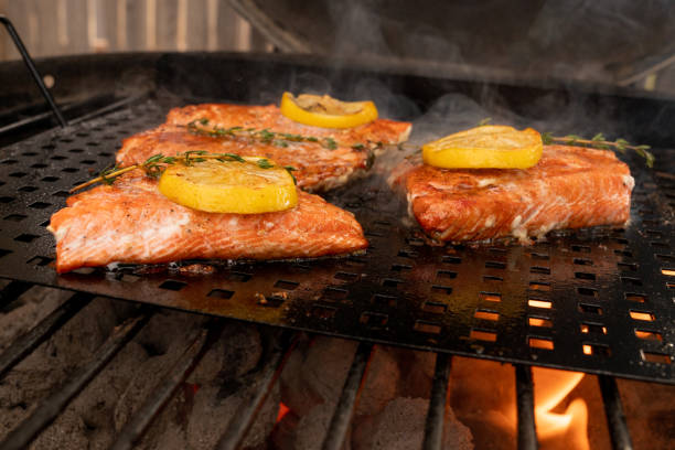istock Salmon Steaks on a Grill with Lemon and Herb 956235028