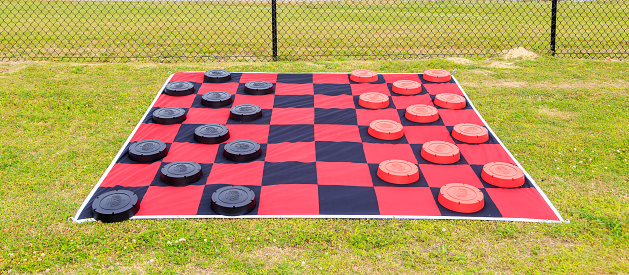 Giant  ground checker board used for kids outdoor games.