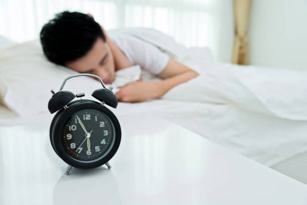 istock Young man asleep in bed 956243474